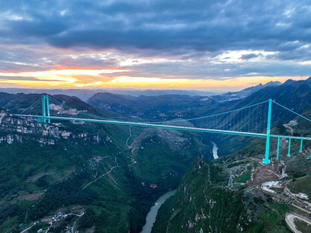 (251215) -- GUIYANG, Dec. 15, 2025 (Xinhua) -- This aerial drone photo taken on Sept. 27, 2025 shows the Huajiang Grand Canyon Bridge in southwest China's Guizhou Province.
  Guizhou, the only province in China without a single plain and home to deep ravines, has long relied on tunnels and bridges to overcome its jagged karst landscape.
  Since 2012, the province has accelerated its bridge construction endeavors. Guizhou now has over 32,000 bridges either already built or under construction -- a tenfold increase compared to the 1980s.
  Due to its sheer number of bridges, diverse bridge types and complex construction technologies, Guizhou has earned the title of "the world's bridge museum." (Xinhua/Ou Dongqu)
