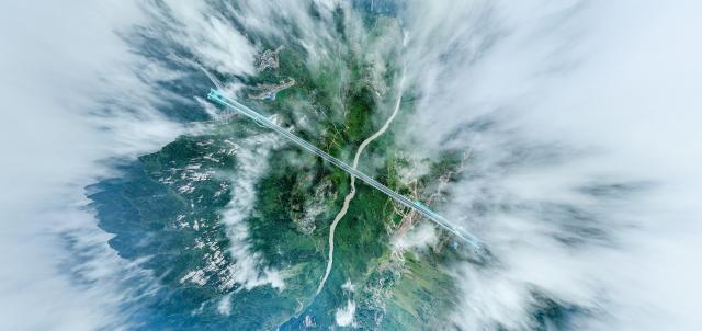 (251215) -- GUIYANG, Dec. 15, 2025 (Xinhua) -- This aerial drone photo taken on Sept. 27, 2025 shows the Huajiang Grand Canyon Bridge in southwest China's Guizhou Province.
  Guizhou, the only province in China without a single plain and home to deep ravines, has long relied on tunnels and bridges to overcome its jagged karst landscape.
  Since 2012, the province has accelerated its bridge construction endeavors. Guizhou now has over 32,000 bridges either already built or under construction -- a tenfold increase compared to the 1980s.
  Due to its sheer number of bridges, diverse bridge types and complex construction technologies, Guizhou has earned the title of "the world's bridge museum." (Xinhua/Ou Dongqu)