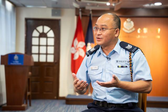 (251215) -- HONG KONG, Dec. 15, 2025 (Xinhua) -- Wong Kai Wing Terence, a neighborhood police coordinator with the Mong Kok District Police Community Relations Office, speaks during an interview with Xinhua in south China's Hong Kong, Sept. 11, 2025. TO GO WITH "Feature: From policing to peacemaking -- A 1930s Hong Kong building's new calling" (Xinhua/Zhu Wei)