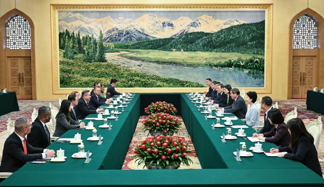 (251215) -- BEIJING, Dec. 15, 2025 (Xinhua) -- Chinese Vice Premier He Lifeng, also a member of the Political Bureau of the Communist Party of China (CPC) Central Committee, meets with a Malaysian delegation led by Anthony Loke Siew Fook, secretary-general of the Democratic Action Party (DAP) and transport minister of Malaysia, in Beijing, capital of China, Dec. 15, 2025. (Xinhua/Dai Tianfang)