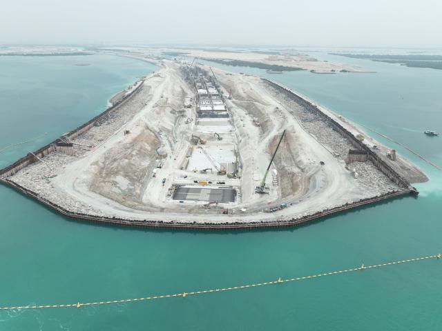 (251215) -- ABU DHABI, Dec. 15, 2025 (Xinhua) -- A drone photo taken on Dec. 5, 2025 shows the construction site of Abu Dhabi 1B tunnel in Abu Dhabi, the United Arab Emirates. TO GO WITH "Roundup: Chinese engineers pioneer innovative subsea tunnel construction in Abu Dhabi" (China Railway Tunnel Group/Handout via Xinhua)