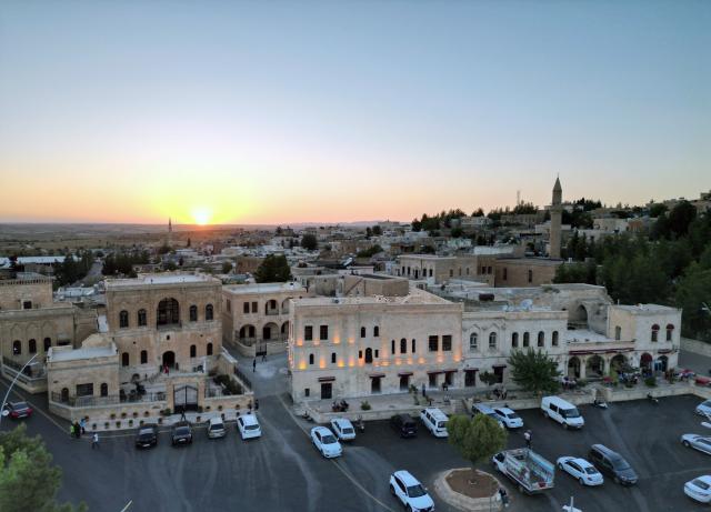 (251215) -- MIDYAT, Dec. 15, 2025 (Xinhua) -- A drone photo taken on Dec. 14, 2025 shows the historic Anitli neighborhood in Midyat, Mardin province, Türkiye. Anitli has been named one of the "Best Tourism Villages 2025" by the United Nations World Tourism Organization (UNWTO), a designation expected to further boost the area's growing tourism momentum. It has preserved its natural charm and is home to historic landmarks that captivate visitors. (Mustafa Kaya/Handout via Xinhua)