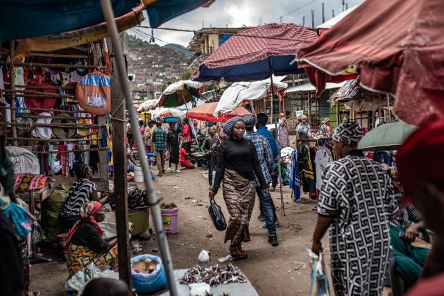 (251215) -- UVIRA, Dec. 15, 2025 (Xinhua) -- People visit a local market in Uvira, a city in South Kivu Province in the eastern Democratic Republic of the Congo (DRC), on Dec. 15, 2025. In Uvira, a strategic city in eastern DRC, streets are being swept, shops are cautiously reopening, and residents are stepping back into public spaces as daily life begins to move again. (Photo by Zanem Nety Zaidi/Xinhua)