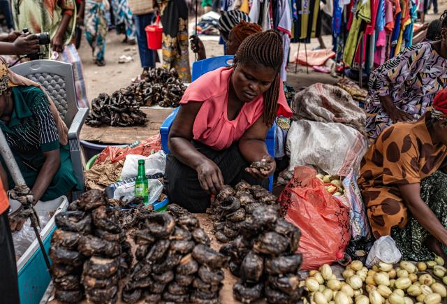 (251215) -- UVIRA, Dec. 15, 2025 (Xinhua) -- A vendor sells goods in Uvira, a city in South Kivu Province in the eastern Democratic Republic of the Congo (DRC), on Dec. 15, 2025. In Uvira, a strategic city in eastern DRC, streets are being swept, shops are cautiously reopening, and residents are stepping back into public spaces as daily life begins to move again. (Photo by Zanem Nety Zaidi/Xinhua)