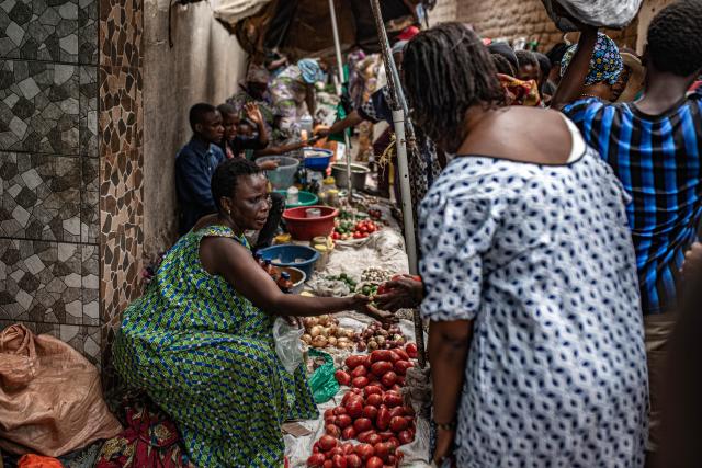 (251215) -- UVIRA, Dec. 15, 2025 (Xinhua) -- Vendors sell goods in Uvira, a city in South Kivu Province in the eastern Democratic Republic of the Congo (DRC), on Dec. 15, 2025. In Uvira, a strategic city in eastern DRC, streets are being swept, shops are cautiously reopening, and residents are stepping back into public spaces as daily life begins to move again. (Photo by Zanem Nety Zaidi/Xinhua)