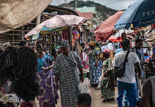 (251215) -- UVIRA, Dec. 15, 2025 (Xinhua) -- People visit a local market in Uvira, a city in South Kivu Province in the eastern Democratic Republic of the Congo (DRC), on Dec. 15, 2025. In Uvira, a strategic city in eastern DRC, streets are being swept, shops are cautiously reopening, and residents are stepping back into public spaces as daily life begins to move again. (Photo by Zanem Nety Zaidi/Xinhua)