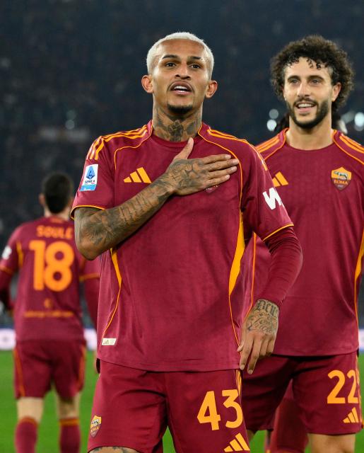 (251216) -- ROME, Dec. 16, 2025 (Xinhua) -- Roma's Wesley Franca (front) celebrates his goal during a Serie A football match between Roma and Como in Rome, Italy, Dec.15, 2025. (Photo by Alberto Lingria/Xinhua)