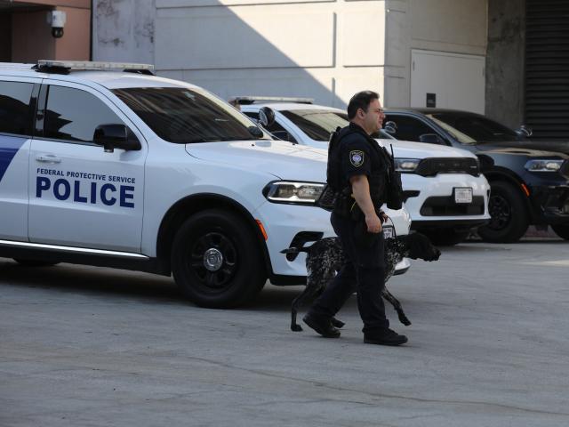 (251216) -- LOS ANGELES, Dec. 16, 2025 (Xinhua) -- A police officer of the U.S. Department of Homeland Security is on duty at the Metropolitan Detention Center in Los Angeles, California, the United States on Dec. 15, 2025. Four people accused of plotting New Year's Eve bombings in California have been arrested, U.S. authorities said Monday. (Photo by Qiu Chen/Xinhua)