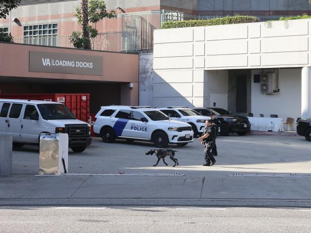 (251216) -- LOS ANGELES, Dec. 16, 2025 (Xinhua) -- Police officers of the U.S. Department of Homeland Security are on duty at the Metropolitan Detention Center in Los Angeles, California, the United States on Dec. 15, 2025. Four people accused of plotting New Year's Eve bombings in California have been arrested, U.S. authorities said Monday. (Photo by Qiu Chen/Xinhua)