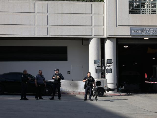 (251216) -- LOS ANGELES, Dec. 16, 2025 (Xinhua) -- Police officers of the U.S. Department of Homeland Security are on duty at the Metropolitan Detention Center in Los Angeles, California, the United States on Dec. 15, 2025. Four people accused of plotting New Year's Eve bombings in California have been arrested, U.S. authorities said Monday. (Photo by Qiu Chen/Xinhua)