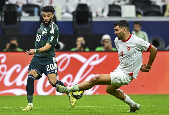 (251216) -- AL KHOR, Dec. 16, 2025 (Xinhua) -- Abdulrahman Alo Bud (L) of Saudi Arabia vies with Husam Abudahab of Jordan during the FIFA Arab Cup 2025 Semi-final match between Saudi Arabia and Jordan at Al Bayt Stadium in Al Khor, Qatar, on Dec. 15, 2025. (Photo by Nikku/Xinhua)
