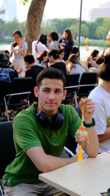 (251216) -- TIANJIN, Dec. 16, 2025 (Xinhua) -- This photo taken in June 2025 shows Azerbaijani youth Ravanov Eldar, known in China as He Yan, participating in a herbal sachet making activity at Tianjin University in north China's Tianjin. TO GO WITH "Feature: A flame igniting cross-cultural dreams" (Xinhua)