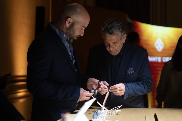 (251216) -- BUENOS AIRES, Dec. 16, 2025 (Xinhua) -- People visit the Huawei product launch event in Buenos Aires, Argentina, Dec. 15, 2025. Chinese tech giant Huawei launched a series of new cellphones and equipment on Monday in Buenos Aires, marking its return to the Argentine smartphone market after six years. (Photo by Martin Zabala/Xinhua)