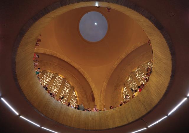 (251216) -- PRETORIA, Dec. 16, 2025 (Xinhua) -- People wait to see the sun shining on the Cenotaph around noon on the Day of Reconciliation at the Voortrekker Monument in Pretoria, South Africa, on Dec. 16, 2025. December 16 was called the Day of the Vow in South Africa. It was renamed the Day of Reconciliation in 1994 after the end of apartheid, with the intention of fostering reconciliation and national unity. (Xinhua/Chen Wei)