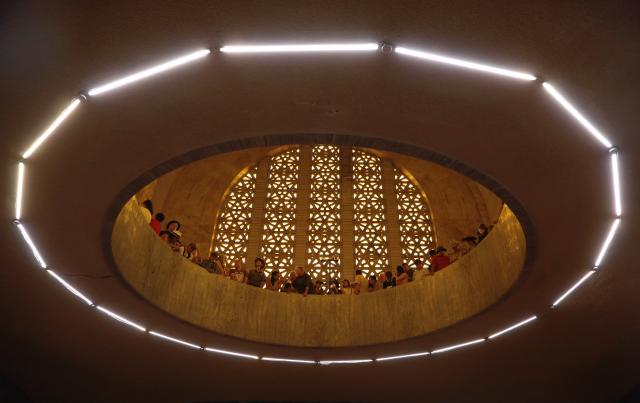 (251216) -- PRETORIA, Dec. 16, 2025 (Xinhua) -- People wait to see the sun shining on the Cenotaph around noon on the Day of Reconciliation at the Voortrekker Monument in Pretoria, South Africa, on Dec. 16, 2025. December 16 was called the Day of the Vow in South Africa. It was renamed the Day of Reconciliation in 1994 after the end of apartheid, with the intention of fostering reconciliation and national unity. (Xinhua/Chen Wei)