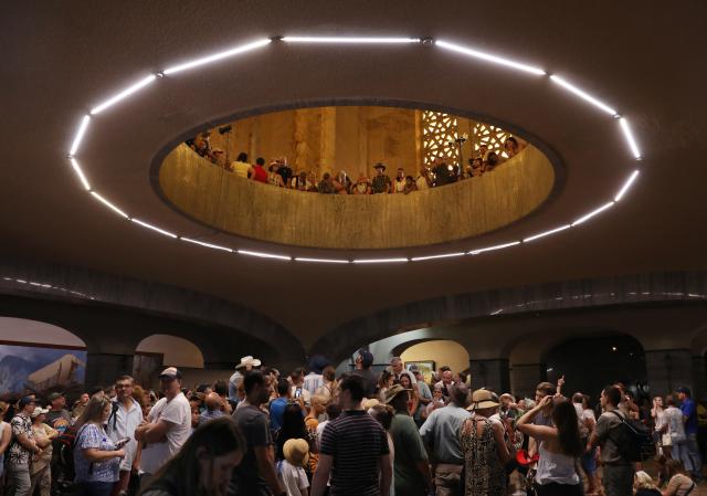 (251216) -- PRETORIA, Dec. 16, 2025 (Xinhua) -- People wait to see the sun shining on the Cenotaph around noon on the Day of Reconciliation at the Voortrekker Monument in Pretoria, South Africa, on Dec. 16, 2025. December 16 was called the Day of the Vow in South Africa. It was renamed the Day of Reconciliation in 1994 after the end of apartheid, with the intention of fostering reconciliation and national unity. (Xinhua/Chen Wei)