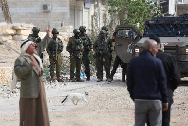 (251216) -- TULKARM, Dec. 16, 2025 (Xinhua) -- Palestinians protest as the Israeli army blocks the street at the main entrance of Nur Shams camp, east of Tulkarm city in the West Bank, on Dec. 15, 2025. (Photo by Nidal Eshtayeh/Xinhua)