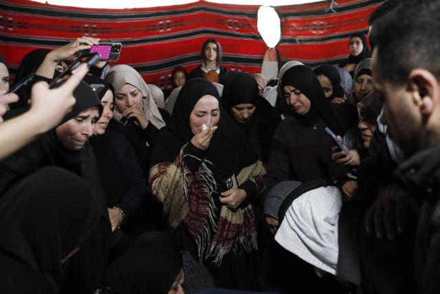 (251217) -- BETHLEHEM, Dec. 17, 2025 (Xinhua) -- Mourners and relatives gather around the body of Palestinian boy Ammar Ta'amra, who was shot dead by Israeli army, during his funeral in the town of Tuqu', southeast of Bethlehem in the West Bank, on Dec. 16, 2025. The 16-year-old Palestinian, Ammar Ta'amra, was shot dead, by the Israeli army during a military raid on Tuqu' on Monday, the Palestinian health ministry said. (Photo by Mamoun Wazwaz/Xinhua)