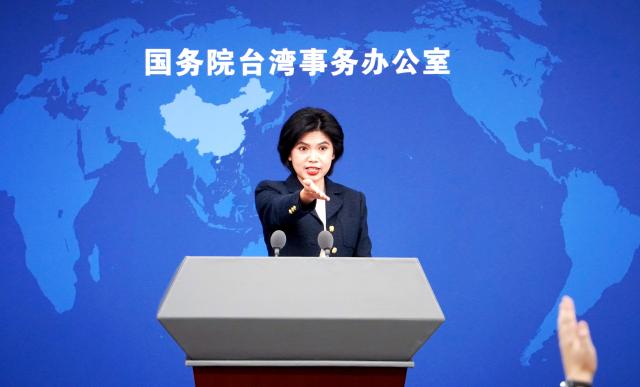 (251217) -- BEIJING, Dec. 17, 2025 (Xinhua) -- Zhu Fenglian, spokesperson for the State Council Taiwan Affairs Office, gestures at a press conference in Beijing, capital of China, Dec. 17, 2025. (Xinhua/Pan Xu)