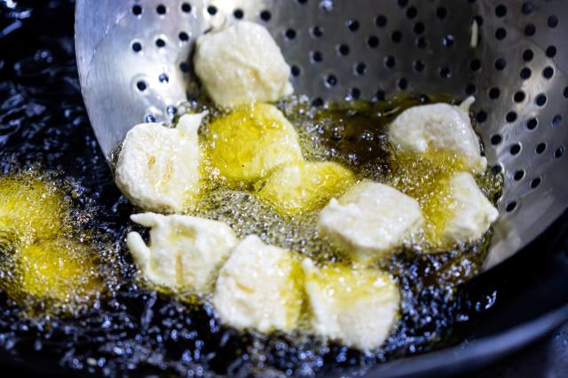(251217) -- GUANGYUAN, Dec. 17, 2025 (Xinhua) -- This photo taken on Dec. 13, 2025 shows the fried Jianmen tofu for a tofu banquet at a restaurant in Jian'ge County of Guangyuan City, southwest China's Sichuan Province.
  Guangyuan, in northern Sichuan Province, run through by the Jialing River and its tributaries, nurtures unique cuisines with its pure water. Across its streets and alleys, bowls of freshly steamed and sliced cold noodles attract people from day and night. Thanks to the ingredients, the cold noodles boast robust flavor of rice.  
  In Jian'ge County under Guangyuan City, Jianmen tofu, a local renowned dish, also made from this pure water with local soybeans, has gained its popularity among local residents as well as tourists. Chefs here also have created various cooking recipes for tofu to express their love for this simple raw material.
  Cooked with traditional skills, local dishes in Guangyuan preserve the original flavor of food materials and evoke the nostalgia for people working away from home. (Xinhua/Lian Zhen)