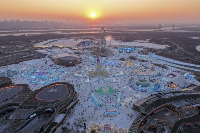 (251217) -- HARBIN, Dec. 17, 2025 (Xinhua) -- An aerial drone photo taken on Dec. 17, 2025 shows the ice sculptures at the Harbin Ice-Snow World in Harbin, northeast China's Heilongjiang Province. The Harbin Ice-Snow World, world's largest ice and snow theme park, officially opened for the season on Wednesday, unveiling its most spectacular edition yet, featuring landmark attractions, thoughtful services and magnificent ice sculptures across a record 1.2 million square meters of park area. (Xinhua/Wang Song)