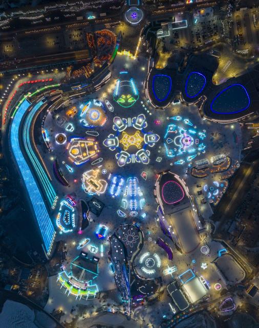 (251217) -- HARBIN, Dec. 17, 2025 (Xinhua) -- An aerial stitched photo taken on Dec. 17, 2025 shows the Harbin Ice-Snow World in Harbin, northeast China's Heilongjiang Province. The Harbin Ice-Snow World, world's largest ice and snow theme park, officially opened for the season on Wednesday, unveiling its most spectacular edition yet, featuring landmark attractions, thoughtful services and magnificent ice sculptures across a record 1.2 million square meters of park area. (Xinhua/Xie Jianfei)