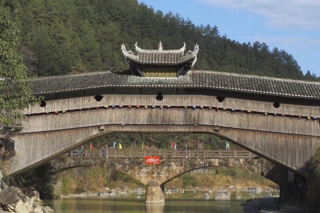 (251217) -- LISHUI, Dec. 17, 2025 (Xinhua) -- This photo taken on Dec. 10, 2025 shows a wooden bridge in Qingyuan County of Lishui City, east China's Zhejiang Province. TO GO WITH "China Focus: Beyond nails and rivets, digital tools safeguard millennium-old bridge craft" (Xinhua/Liu Ziyi)