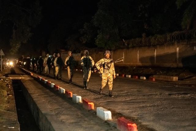 (251217) -- UVIRA, Dec. 17, 2025 (Xinhua) -- This photo taken with a mobile phone shows members of the March 23 Movement (M23) rebel group on the move in Uvira, in the eastern Democratic Republic of the Congo (DRC), on Dec. 17, 2025. Fighters from the M23 rebel group on Wednesday began withdrawing from their positions in Uvira, a Xinhua reporter observed on the ground. (Photo by Alain Uaykani/Xinhua)