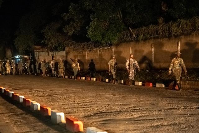 (251217) -- UVIRA, Dec. 17, 2025 (Xinhua) -- This photo taken with a mobile phone shows members of the March 23 Movement (M23) rebel group on the move in Uvira, in the eastern Democratic Republic of the Congo (DRC), on Dec. 17, 2025. Fighters from the M23 rebel group on Wednesday began withdrawing from their positions in Uvira, a Xinhua reporter observed on the ground. (Photo by Alain Uaykani/Xinhua)