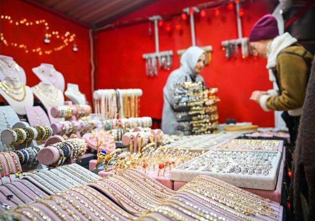 (251217) -- ISTANBUL, Dec. 17, 2025 (Xinhua) -- Customers shop at the New Year Shopping Festival at the Clock Tower Square of Galataport in Istanbul, Türkiye, Dec. 17, 2025. As the New Year approaches, tents have been set up at Clock Tower Square in Galataport for a New Year Shopping Festival, offering a variety of festive-themed goods. (Xinhua/Liu Lei)