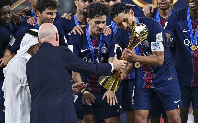 (251218) -- AL RAYYAN, Dec. 18, 2025 (Xinhua) -- FIFA President, Gianni Infantino (front, 2nd L) presents a trophy to Marquinhos (front, 1st R) of Paris Saint-Germain (PSG) during the podium ceremony after the FIFA Intercontinental Cup 2025 final match between France's Paris Saint-Germain (PSG) and Brazil's CR Flamengo in Al Rayyan, Qatar, on Dec. 17, 2025. (Photo by Nikku/Xinhua)