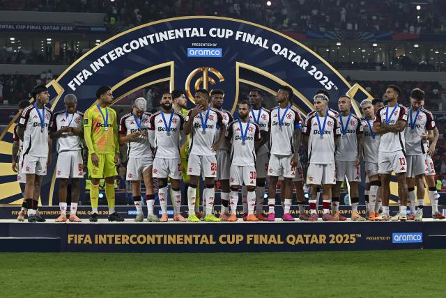 (251218) -- AL RAYYAN, Dec. 18, 2025 (Xinhua) -- Players of CR Flamengo react during the podium ceremony after the FIFA Intercontinental Cup 2025 final match between France's Paris Saint-Germain (PSG) and Brazil's CR Flamengo in Al Rayyan, Qatar, on Dec. 17, 2025. (Photo by Nikku/Xinhua)