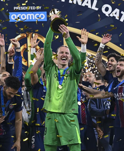 (251218) -- AL RAYYAN, Dec. 18, 2025 (Xinhua) -- Matvey Safonov (front) of Paris Saint-Germain (PSG) lifts the trophy after the FIFA Intercontinental Cup 2025 final match between France's Paris Saint-Germain (PSG) and Brazil's CR Flamengo in Al Rayyan, Qatar, on Dec. 17, 2025. (Photo by Nikku/Xinhua)
