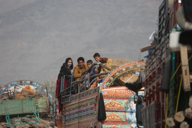 (251218) -- TORKHAM, Dec. 18, 2025 (Xinhua) -- Afghan returnees are seen on a truck bound for their home province from a temporary camp at the Torkham border crossing, Afghanistan, Dec. 16, 2025. As the world marks International Migrants Day on Thursday, the unfolding narrative in Afghanistan is one of resilience and uncertainty.
  The forced return of thousands from neighboring countries is reshaping lives: many families are coming back to a homeland they barely know, striving to rebuild amid fragile security and limited support. (Photo by Saifurahman Safi/Xinhua)