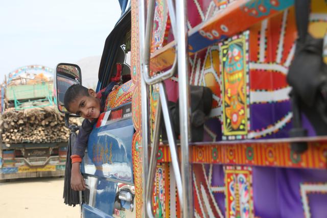(251218) -- TORKHAM, Dec. 18, 2025 (Xinhua) -- A boy is seen on a truck bound for his home province from a temporary camp at the Torkham border crossing, Afghanistan, Dec. 16, 2025. As the world marks International Migrants Day on Thursday, the unfolding narrative in Afghanistan is one of resilience and uncertainty.
  The forced return of thousands from neighboring countries is reshaping lives: many families are coming back to a homeland they barely know, striving to rebuild amid fragile security and limited support. (Photo by Saifurahman Safi/Xinhua)