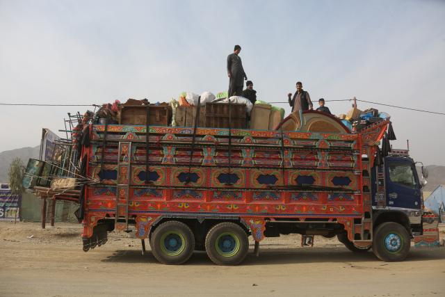 (251218) -- TORKHAM, Dec. 18, 2025 (Xinhua) -- Afghan returnees are seen on a truck bound for their home province from a temporary camp at the Torkham border crossing, Afghanistan, Dec. 16, 2025. As the world marks International Migrants Day on Thursday, the unfolding narrative in Afghanistan is one of resilience and uncertainty.
  The forced return of thousands from neighboring countries is reshaping lives: many families are coming back to a homeland they barely know, striving to rebuild amid fragile security and limited support. (Photo by Saifurahman Safi/Xinhua)