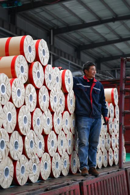 (251218) -- GUANGYUAN, Dec. 18, 2025 (Xinhua) -- A worker works at a roll flooring manufacturing workshop in Guangyuan, southwest China's Sichuan Province, Dec. 12, 2025. The home furnishing industry of Guangyuan stands out for its high quality, and its roll flooring products sell well across China and overseas.  
  In Tashkent, the capital of Uzbekistan, a building supplies store that sells flooring products from Guangyuan is doing brisk business. Jamshid Tashpulatov, the owner of the store, hopes to cooperate with more Chinese companies as the business keeps growing.
  Historically a key stop connecting China with other countries, Guangyuan is now emerging as a new landmark for western China's opening up. (Xinhua/Chen Zhenhai)