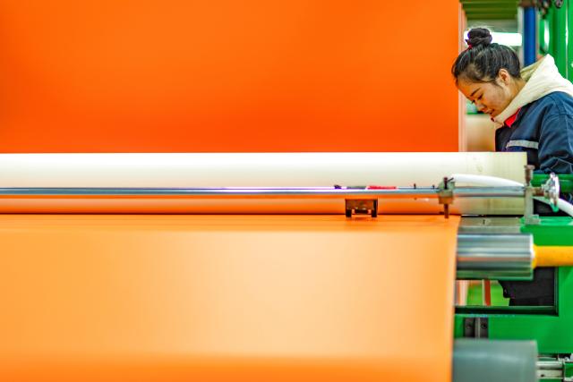 (251218) -- GUANGYUAN, Dec. 18, 2025 (Xinhua) -- A worker works at a roll flooring manufacturing workshop in Guangyuan, southwest China's Sichuan Province, Dec. 12, 2025. The home furnishing industry of Guangyuan stands out for its high quality, and its roll flooring products sell well across China and overseas.  
  In Tashkent, the capital of Uzbekistan, a building supplies store that sells flooring products from Guangyuan is doing brisk business. Jamshid Tashpulatov, the owner of the store, hopes to cooperate with more Chinese companies as the business keeps growing.
  Historically a key stop connecting China with other countries, Guangyuan is now emerging as a new landmark for western China's opening up. (Xinhua/Jiang Fan)