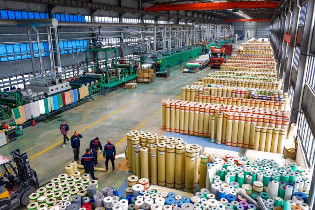 (251218) -- GUANGYUAN, Dec. 18, 2025 (Xinhua) -- A drone photo taken on Dec. 12, 2025 shows a view of a roll flooring manufacturing workshop in Guangyuan, southwest China's Sichuan Province. The home furnishing industry of Guangyuan stands out for its high quality, and its roll flooring products sell well across China and overseas.  
  In Tashkent, the capital of Uzbekistan, a building supplies store that sells flooring products from Guangyuan is doing brisk business. Jamshid Tashpulatov, the owner of the store, hopes to cooperate with more Chinese companies as the business keeps growing.
  Historically a key stop connecting China with other countries, Guangyuan is now emerging as a new landmark for western China's opening up. (Xinhua/Jiang Fan)