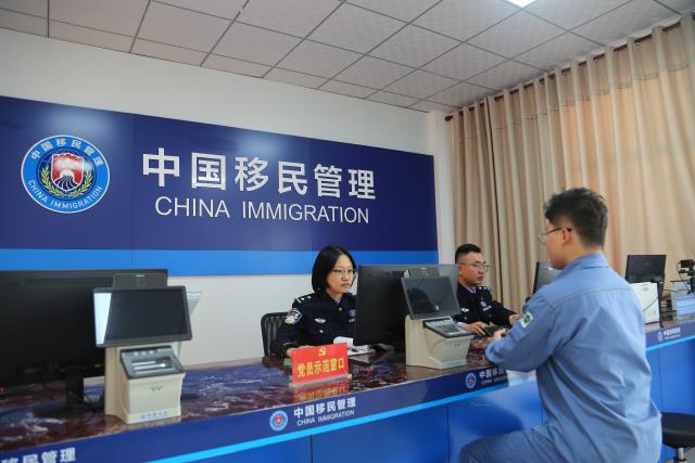 (251218) -- HAIKOU, Dec. 18, 2025 (Xinhua) -- Officers process border procedures for a ship in Yangpu of Danzhou, south China's Hainan Province, Dec. 18, 2025. China on Thursday launched island-wide special customs operations in the Hainan Free Trade Port (FTP). (Photo by Wu Yue/Xinhua)