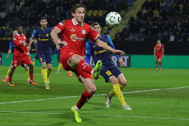 (251219) -- CELJE, Dec. 19, 2025 (Xinhua) -- Harry Wood (front) of Shelbourne FC competes during the UEFA Conference League match between NK Celje and Shelbourne FC in Celje, Slovenia, Dec. 18, 2025. (Photo by Zeljko Stevanic/Xinhua)