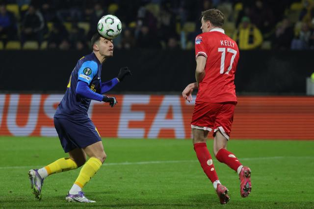 (251219) -- CELJE, Dec. 19, 2025 (Xinhua) -- Milot Avdyli (L) of NK Celje competes for a header during the UEFA Conference League match between NK Celje and Shelbourne FC in Celje, Slovenia, Dec. 18, 2025. (Photo by Zeljko Stevanic/Xinhua)