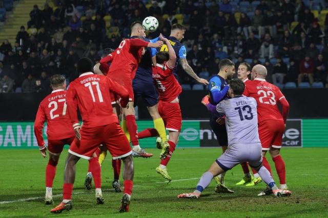 (251219) -- CELJE, Dec. 19, 2025 (Xinhua) -- Damjan Vuklisevic (4th L) of NK Celje competes for a header during the UEFA Conference League match between NK Celje and Shelbourne FC in Celje, Slovenia, Dec. 18, 2025. (Photo by Zeljko Stevanic/Xinhua)