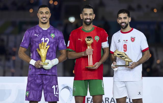 (251219) -- LUSAIL, Dec. 19, 2025 (Xinhua) -- El Mehdi Benabid of Morocco, Golden Glove, Mohamed Rabie Hrimat of Morocco, Player of the Tournament, and Ali Olwan of Jordan (from L to R), Golden Boot, pose with trophies after the FIFA Arab Cup 2025 final match between Jordan and Morocco at Lusail Stadium in Lusail, Qatar, on Dec. 18, 2025. (Photo by Nikku/Xinhua)