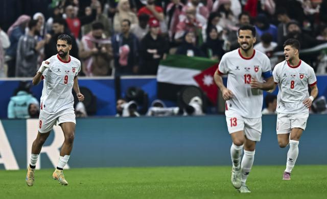 (251219) -- LUSAIL, Dec. 19, 2025 (Xinhua) -- Ali Olwan (L) of Jordan celebrates after scoring a goal during the FIFA Arab Cup 2025 final match between Jordan and Morocco at Lusail Stadium in Lusail, Qatar, on Dec. 18, 2025. (Photo by Nikku/Xinhua)