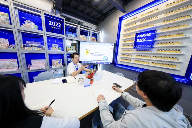 (251219) -- GUANGZHOU, Dec. 19, 2025 (Xinhua) -- A trainer introduces new products to new recruits at Guangzhou Moetch Cultural & Creative Co., Ltd. in Guangzhou, south China's Guangdong Province, Oct. 28, 2025.
  China is one of the world's largest markets and production bases for trendy toys. "Trendy toys," ranging from blind boxes to IP-themed merchandise, have emerged as a niche but fast-growing segment, reflecting the rise of emotion-driven consumption in the country.
  No longer just a manufacturing hub, China is also emerging as a source of original cultural exports and designed-in-China trendy toys are gaining international popularity. 
  Since 2024, a series of Chinese cultural and creative products have become breakout hits and trending topics online. Some well-known IPs, such as Labubu, Nezha, and Wukong, have raised waves of consumption craze through films, games, and various cultural derivatives.
  The country's designer toy market, valued at roughly 60 billion yuan (about 8.52 billion U.S. dollars) in 2023, is projected to reach 110.1 billion yuan by 2026, with annual growth rate exceeding 20 percent. (Xinhua/Mao Siqian)
