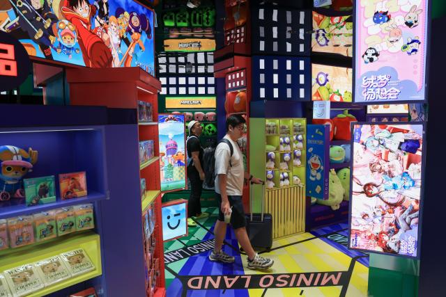 (251219) -- GUANGZHOU, Dec. 19, 2025 (Xinhua) -- People visit a MINISO LAND store in Guangzhou, south China's Guangdong Province, Oct. 28, 2025.
  China is one of the world's largest markets and production bases for trendy toys. "Trendy toys," ranging from blind boxes to IP-themed merchandise, have emerged as a niche but fast-growing segment, reflecting the rise of emotion-driven consumption in the country.
   No longer just a manufacturing hub, China is also emerging as a source of original cultural exports and designed-in-China trendy toys are gaining international popularity. 
   Since 2024, a series of Chinese cultural and creative products have become breakout hits and trending topics online. Some well-known IPs, such as Labubu, Nezha, and Wukong, have raised waves of consumption craze through films, games, and various cultural derivatives.
   The country's designer toy market, valued at roughly 60 billion yuan (about 8.52 billion U.S. dollars) in 2023, is projected to reach 110.1 billion yuan by 2026, with annual growth rate exceeding 20 percent. (Xinhua/Mao Siqian)