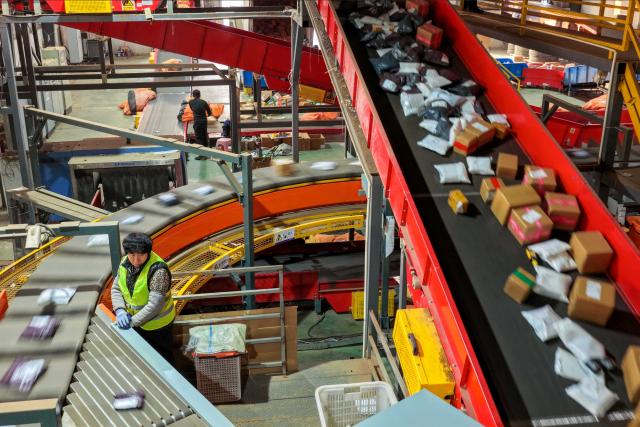 (251219) -- LAOLING, Dec. 19, 2025 (Xinhua) -- A worker sorts out packages at a logistics center in Yang'an County of Laoling City, east China's Shandong Province, Dec. 18, 2025. The tiny town of Yang'an in Laoling, a county-level city, has built a seasoning empire that reaches over 70 countries and regions, and has captured 40 percent of China's composite spice market. 
   Currently there are no less than 327 condiment production and processing enterprises operating in Yang'an, generating more than 30 billion yuan (about 4.26 billion U.S. dollars) in annual sales. (Photo by Li Xinjun/Xinhua)