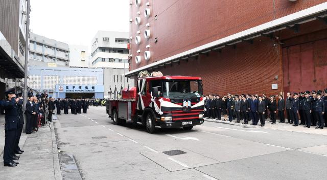 (251219) -- HONG KONG, Dec. 19, 2025 (Xinhua) -- A hearse converted from a fire engine leaves the Universal Funeral Parlour in Hung Hom, Kowloon, south China's Hong Kong, Dec. 19, 2025. The Fire Services Department (FSD) of the Hong Kong Special Administrative Region (HKSAR) government on Friday held an official funeral service with full honors for the late firefighter Ho Wai-ho, who sacrificed his life battling a major blaze in Tai Po. John Lee, chief executive of the HKSAR and a host of senior HKSAR government officials attended the ceremony to pay their respects.
   TO GO WITH "Funeral with full honors held in Hong Kong for late firefighter Ho Wai-ho" (Xinhua/Chen Duo)