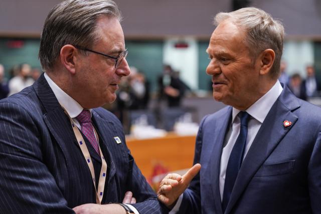 (251219) -- BRUSSELS, Dec. 19, 2025 (Xinhua) -- Belgian Prime Minister Bart De Wever (L) talks with Poland's Prime Minister Donald Tusk before a European Council summit in Brussels, Belgium, Dec. 18, 2025. The European Council on Friday approved a 90-billion-euro (about 105.4 billion U.S. dollars) loan package to support Ukraine's military and economic needs over the next two years.
   According to a European Council statement, the loan will be financed through European Union borrowing on the capital markets and backed by the EU budget "headroom," the unused margin in the budget that can be mobilized as a guarantee to support EU borrowing. (Xinhua/Peng Ziyang)